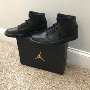 Triple black Jordan 1 mid